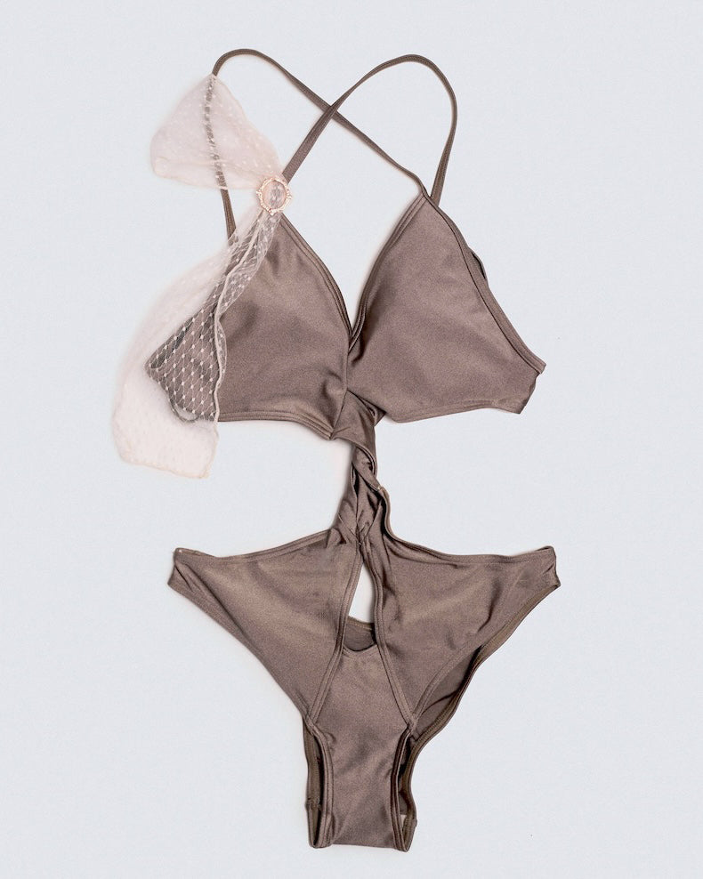 Lay flat view of Matilda bodysuit in ash brown with twisted centre front waist