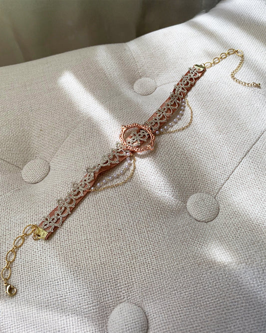 Close-up of details on handmade rose gold choker