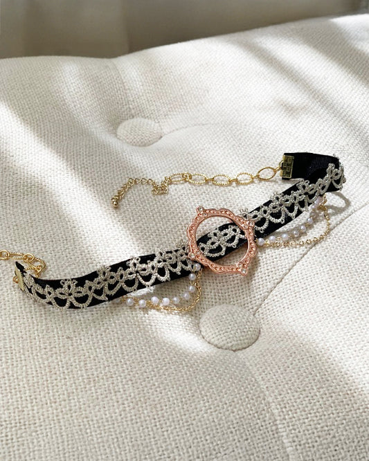 Close-up of tatting lace detail on handmade black choker
