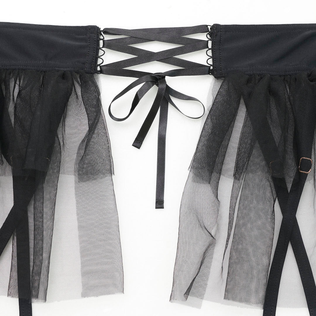 closeup of Black tutu skirt with detachable suspenders and layered tulle detailing