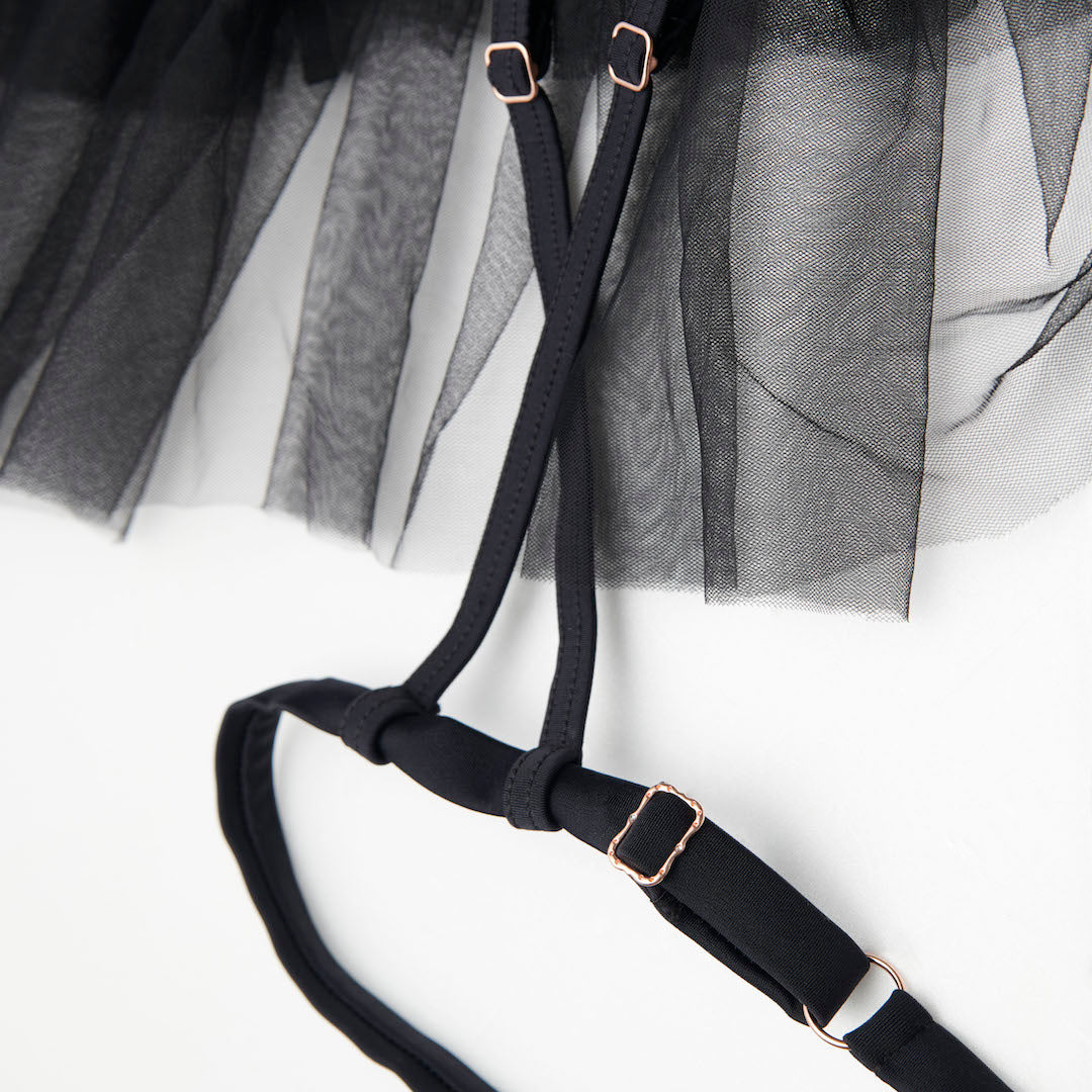 closeup of garters of black tutu skirt for pole dance n jazz heels